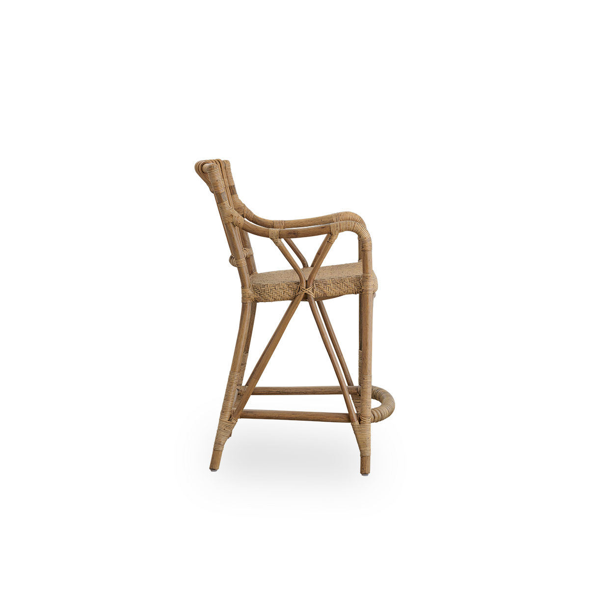 Plain side view of Blues Counter stool in antique brown color made of Indonesian rattan. Handwoven seat on a rattan frame with rattan back rest.
