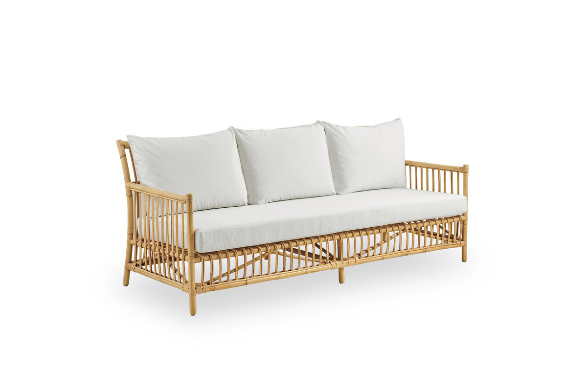 Side view of Caroline 3-seater wicker sofa, simple and elegant Danish design. Handcrafted from Indonesian rattan with detailed woven accents for a cozy, calming presence.