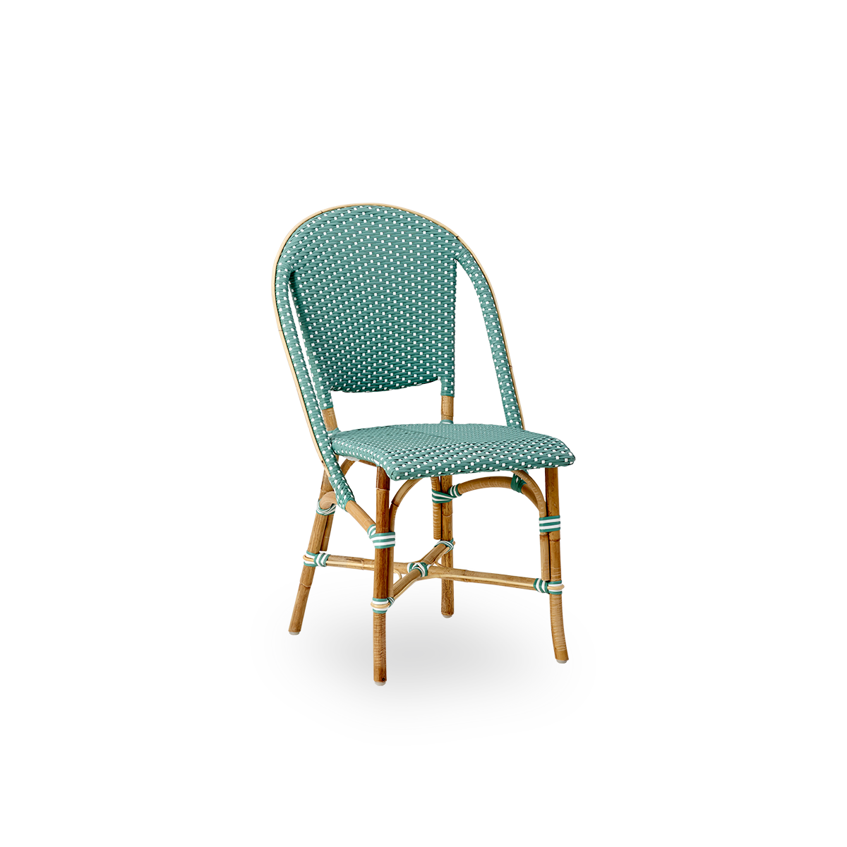 Side view of Sofie rattan dining chair inspired by French café style. Rattan frame with fully woven seat- and backrest handcrafted in ArtFibre in sage green with white dots pattern. Stackable rattan bistro chair.