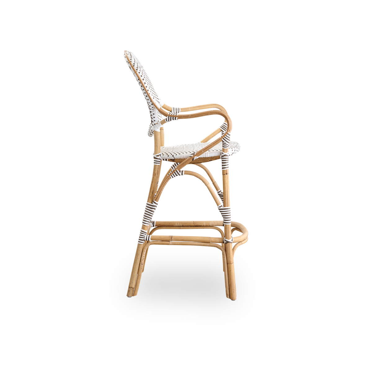 Plain side view of Isabell barstool with high bagrest, armrests and footrest. Natural rattan frame with ArtFibre seat in white with cappuccino dots. Inspired by 1950s bistro design.