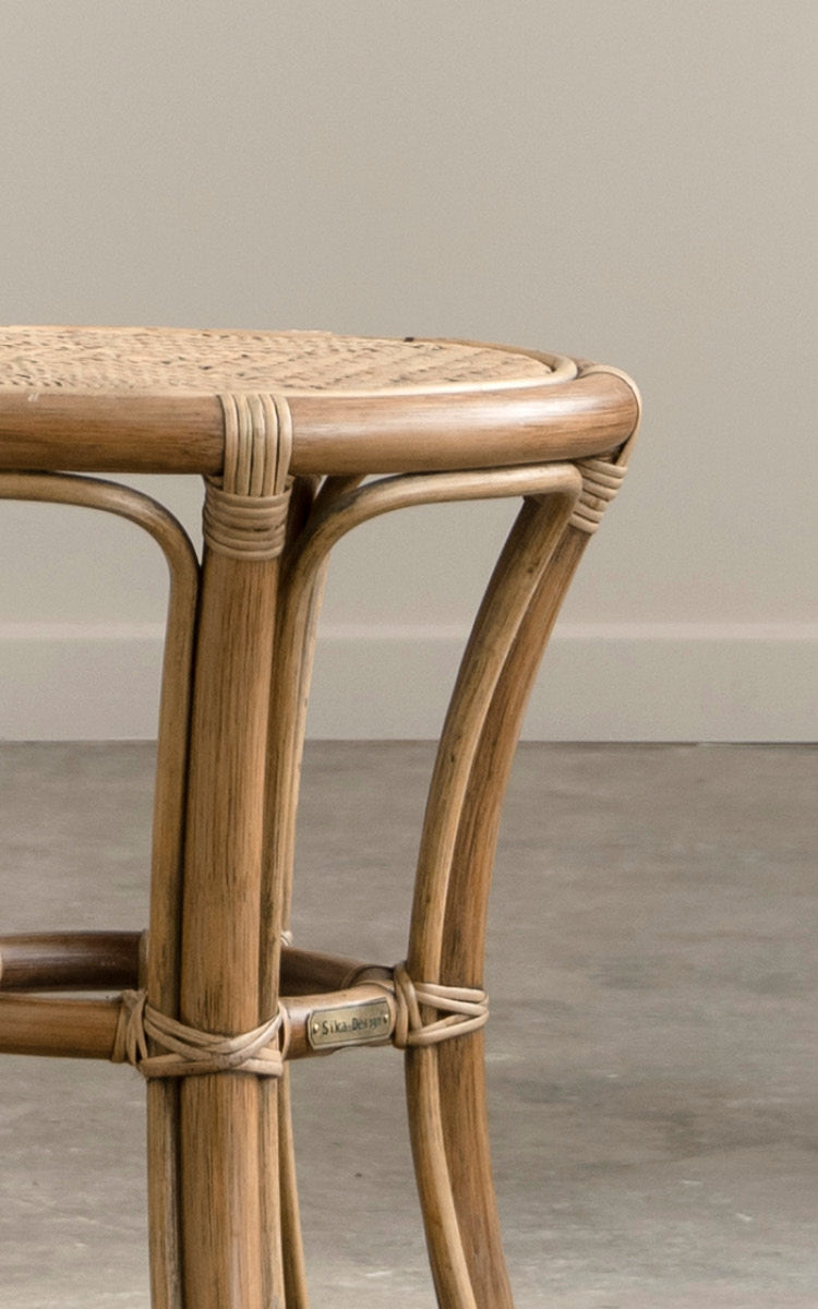 This is a close-up image of Bella Stool in antique rattan.