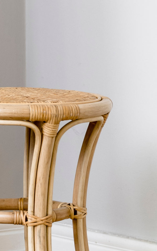 This is a close-up image of Bella Stool in natural rattan.