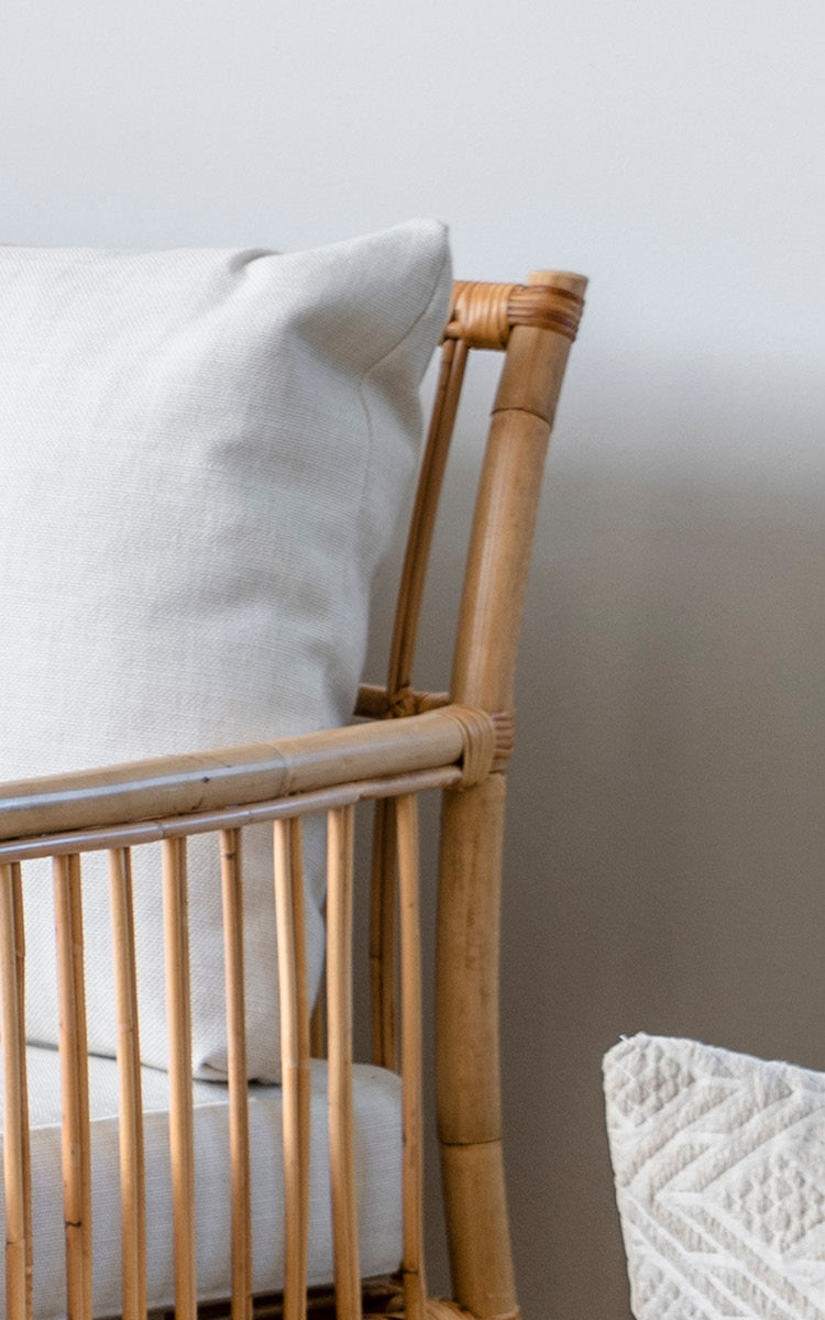 This is a close-up image of Caroline Sofa in natural rattan.