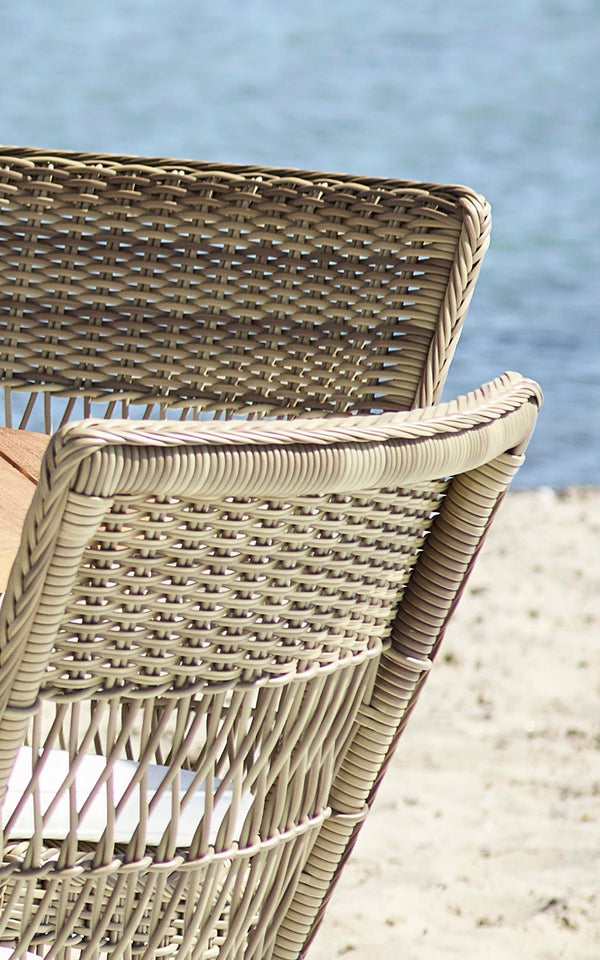 This is a close-up image of Marie Exterior Side Chair in antique grey artfibre aluminium. Detail of the cross-lattice weave pattern.