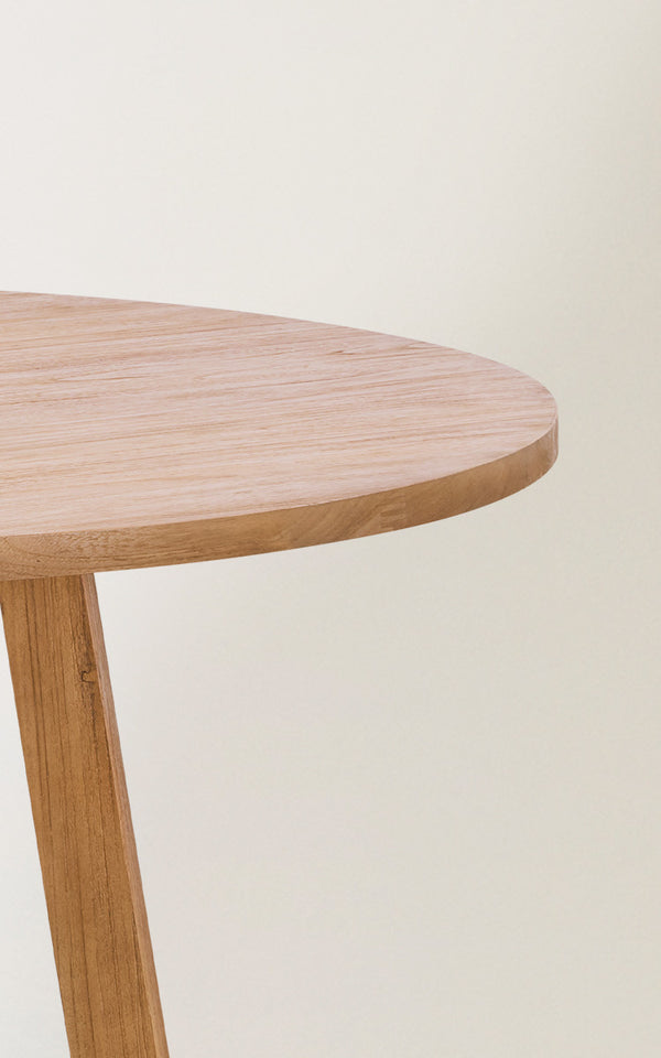 This is a close-up image of Aksel Dining Table in teak indoor.