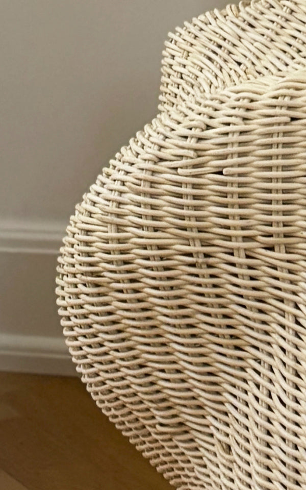 This is a close-up image of Solaris Basket Ø46 cm in natural core weave iron frame. Detail of the larger open rattan ring basket with cross bindings.