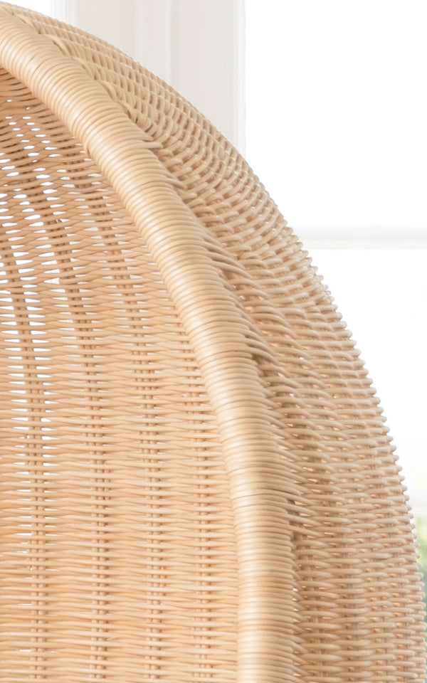 This is a close-up image of Hanging Egg Chair Junior in natural core weave Rattan frame.