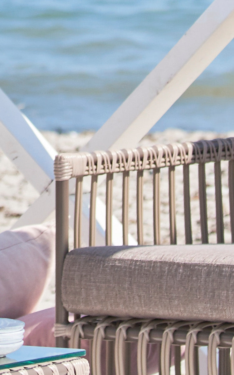 This is a close-up image of Caroline Exterior Lounge Chair in moccaccino Aluminium ArtFibre.