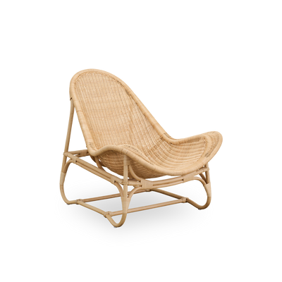Side view of Pacifique lounge chair by Michel Buffet. Elegant design handcrafted in rattan with fully woven seat.