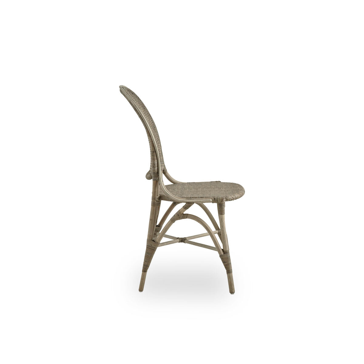 Plain side view of Rossini dining chair in Taupe color. Elegant wicker chair with round backrest in simple design. Handcrafted from high quality rattan.