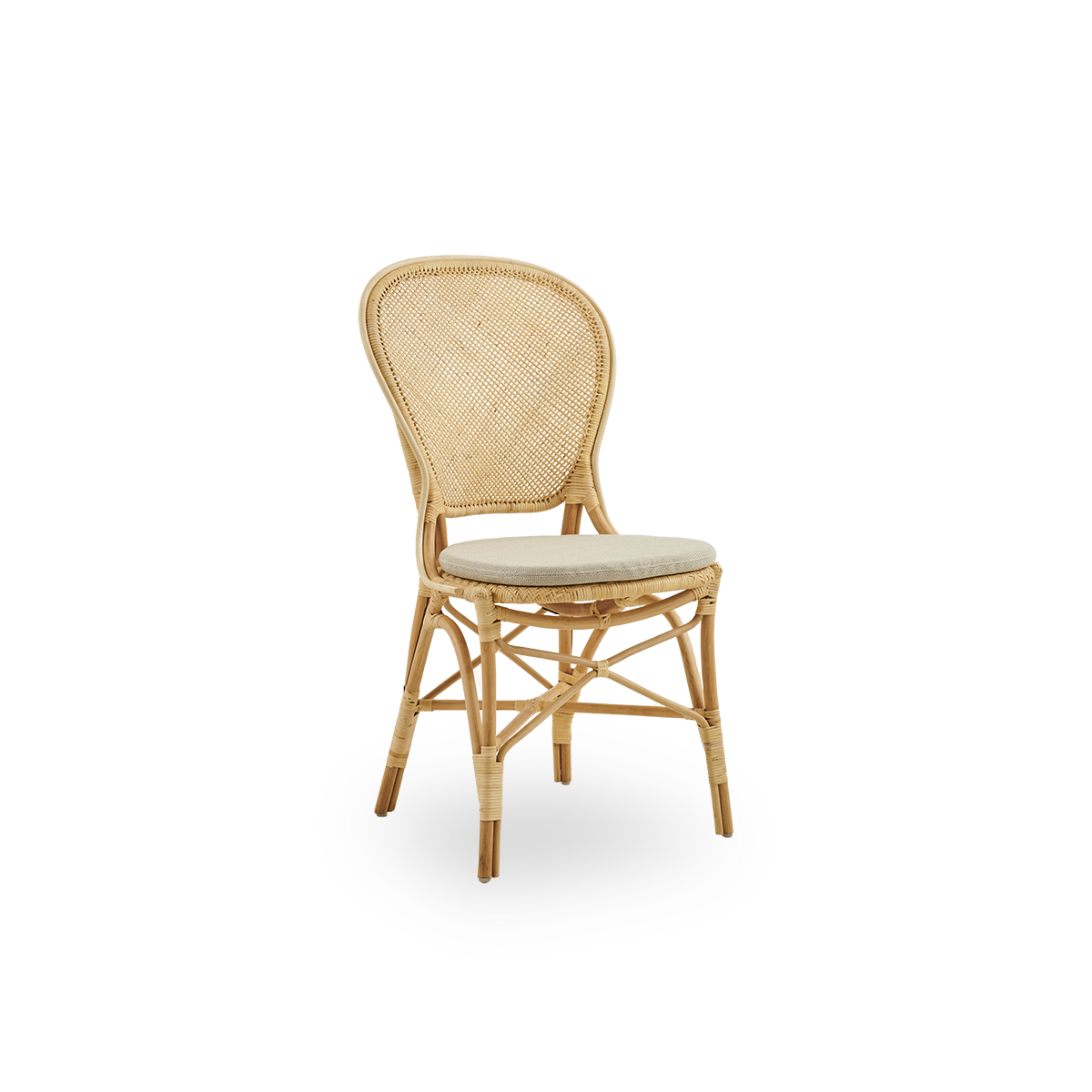 Side view of Rossini dining chair in natural rattan. Elegant wicker chair with round backrest in simple design. Handcrafted from high quality rattan.