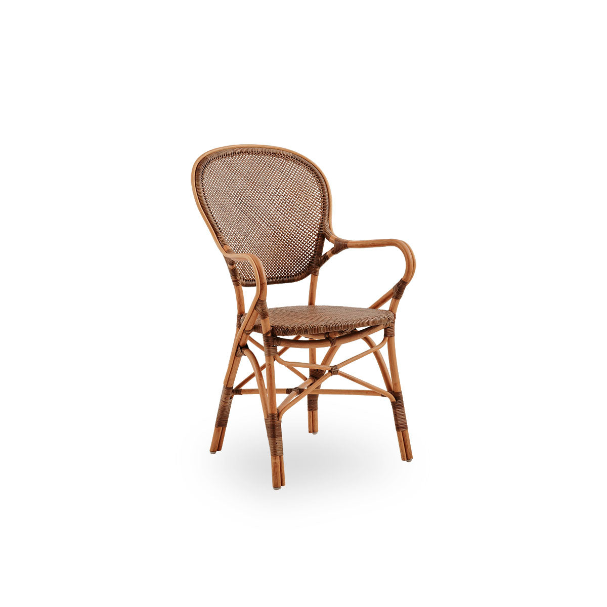 Side view of Rossini dining armchair in Cherry color. Elegant wicker chair with round backrest and armrests in simple design. Handcrafted from high quality rattan.