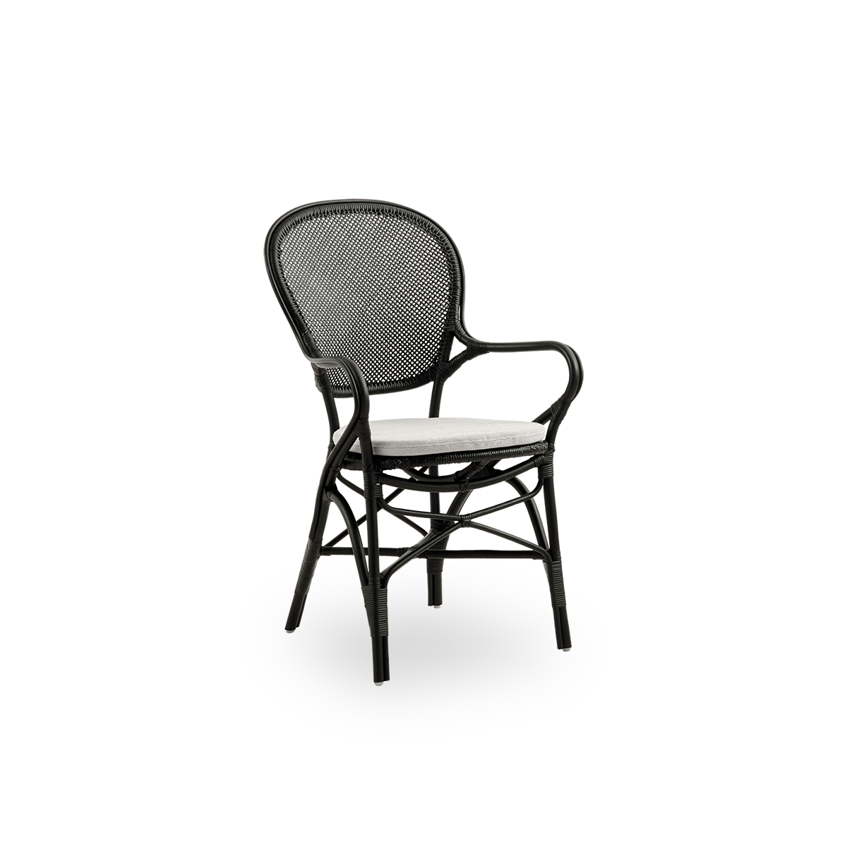 Side view of Rossini dining armchair in black color. Elegant wicker chair with round backrest and armrests in simple design. Handcrafted from high quality rattan.