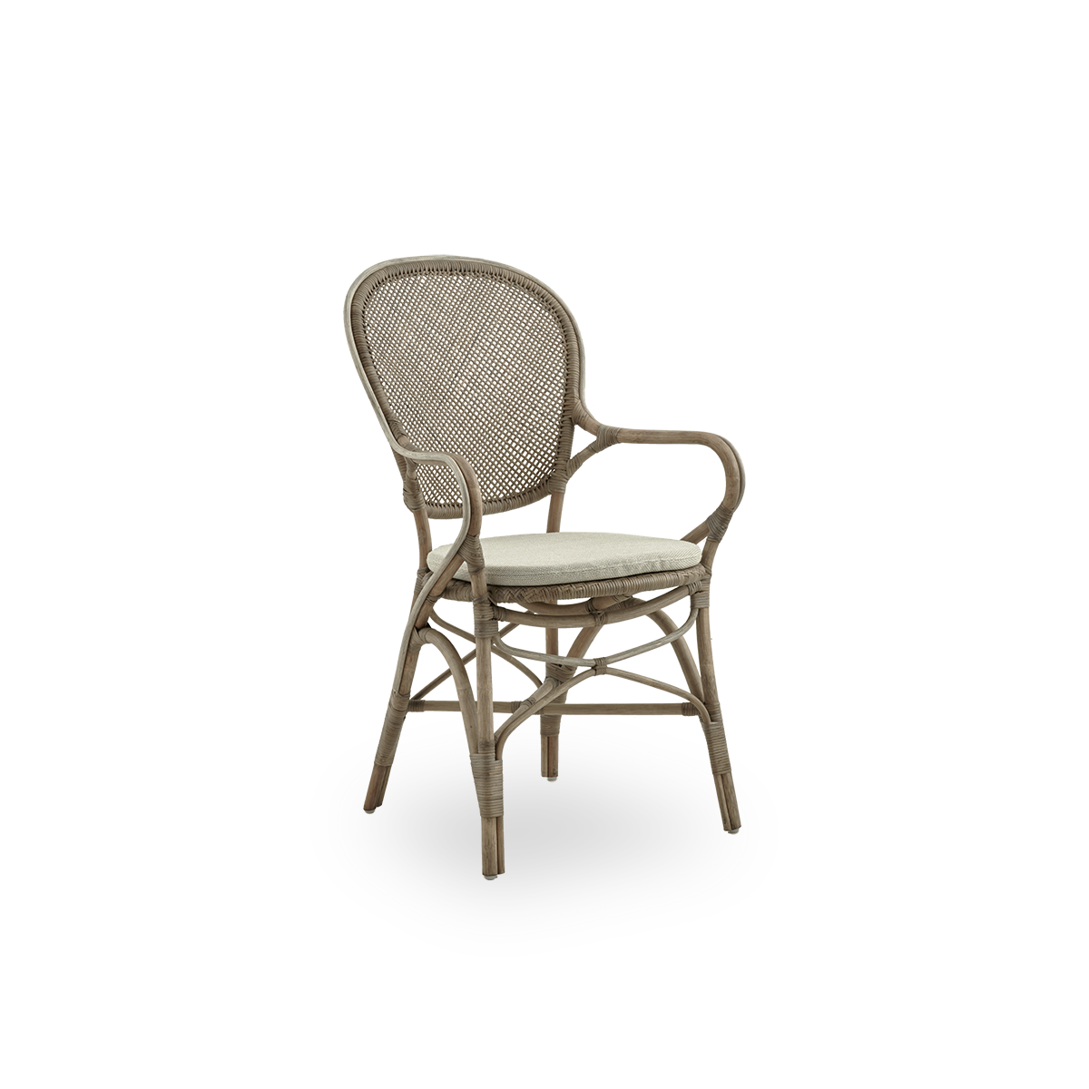 Side view of Rossini dining armchair in Taupe color. Elegant wicker chair with round backrest and armrests in simple design. Handcrafted from high quality rattan.