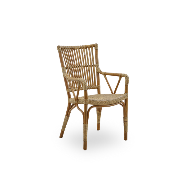 Side view of Piano armchair in Antique brown color. Elegant wicker chair with high backrest and armrests handcrafted from high quality Indonesian rattan.