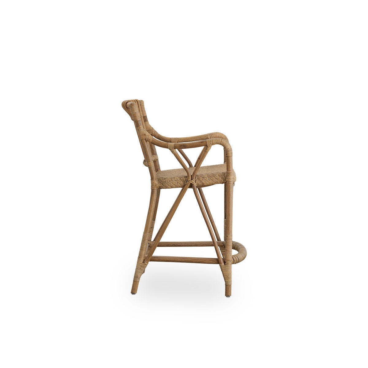 Plain side view of Blues Counter stool in antique brown color made of Indonesian rattan. Handwoven seat on a rattan frame with rattan back rest.