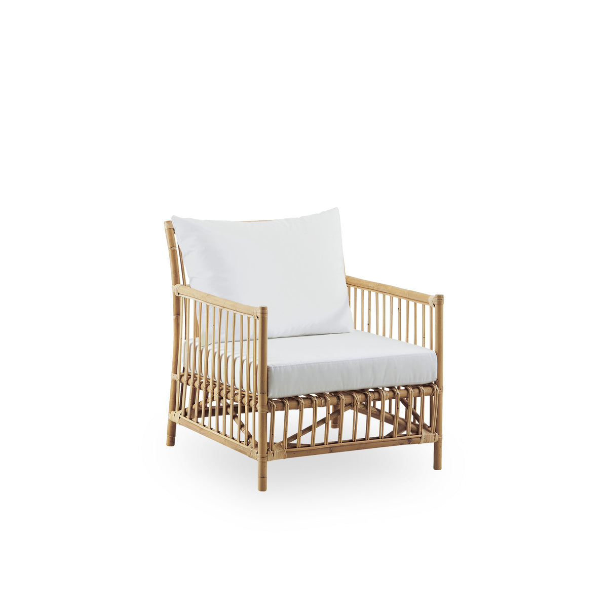 Side view of Caroline Lounge Chair, simple and elegant Danish design. Handcrafted from Indonesian rattan. The chair has a cozy, calming presence.