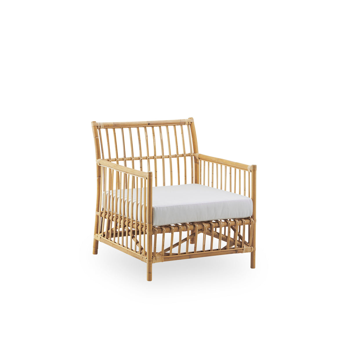 Side view of Caroline Lounge Chair, simple and elegant Danish design. Handcrafted from Indonesian rattan. The chair has a cozy, calming presence.