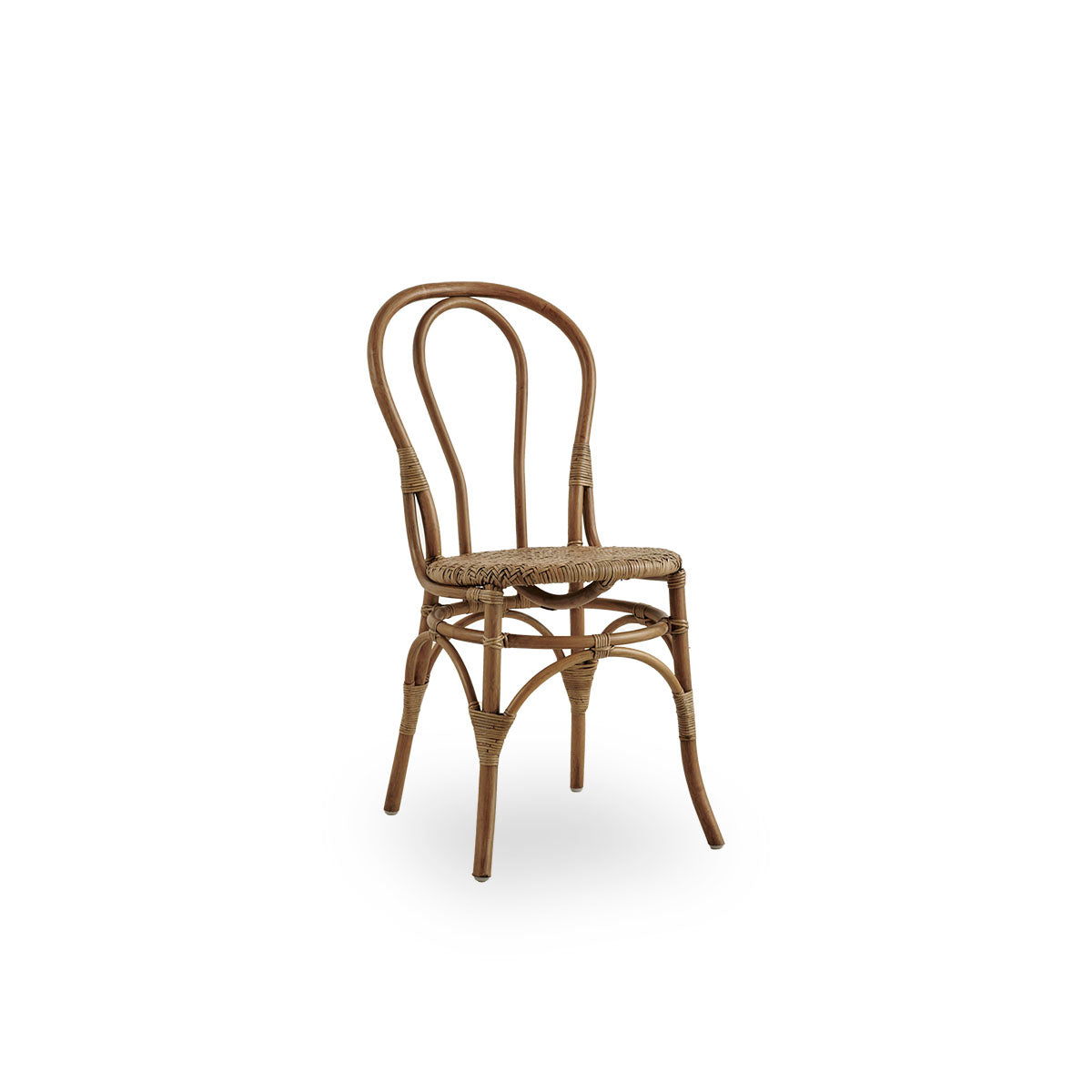 Side view of Lulu dining chair in Antique brown color, handcrafted from high-quality Indonesian rattan. Lightweight, elegant design with round simple backrest.