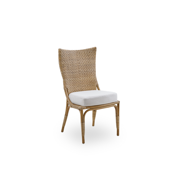 Side view of Melody dining chair in Antique rattan color with high fully woven rattan backrest and upholstery seat.