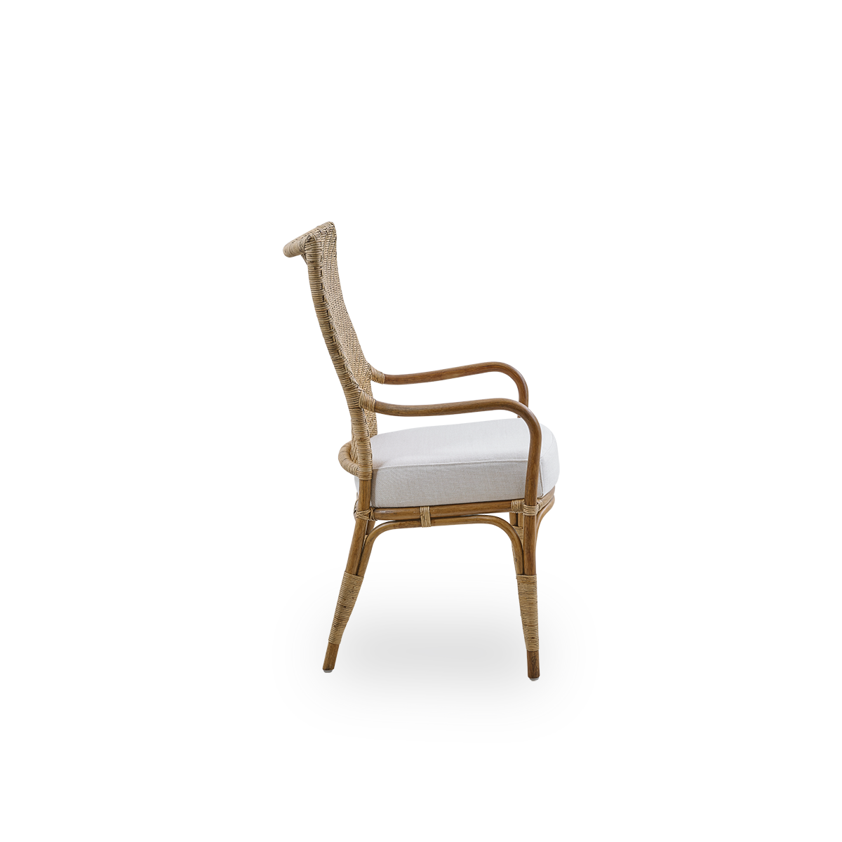 Plain side view of Melody dining armchair in Antique rattan color with high fully woven rattan backrest and upholstery seat.