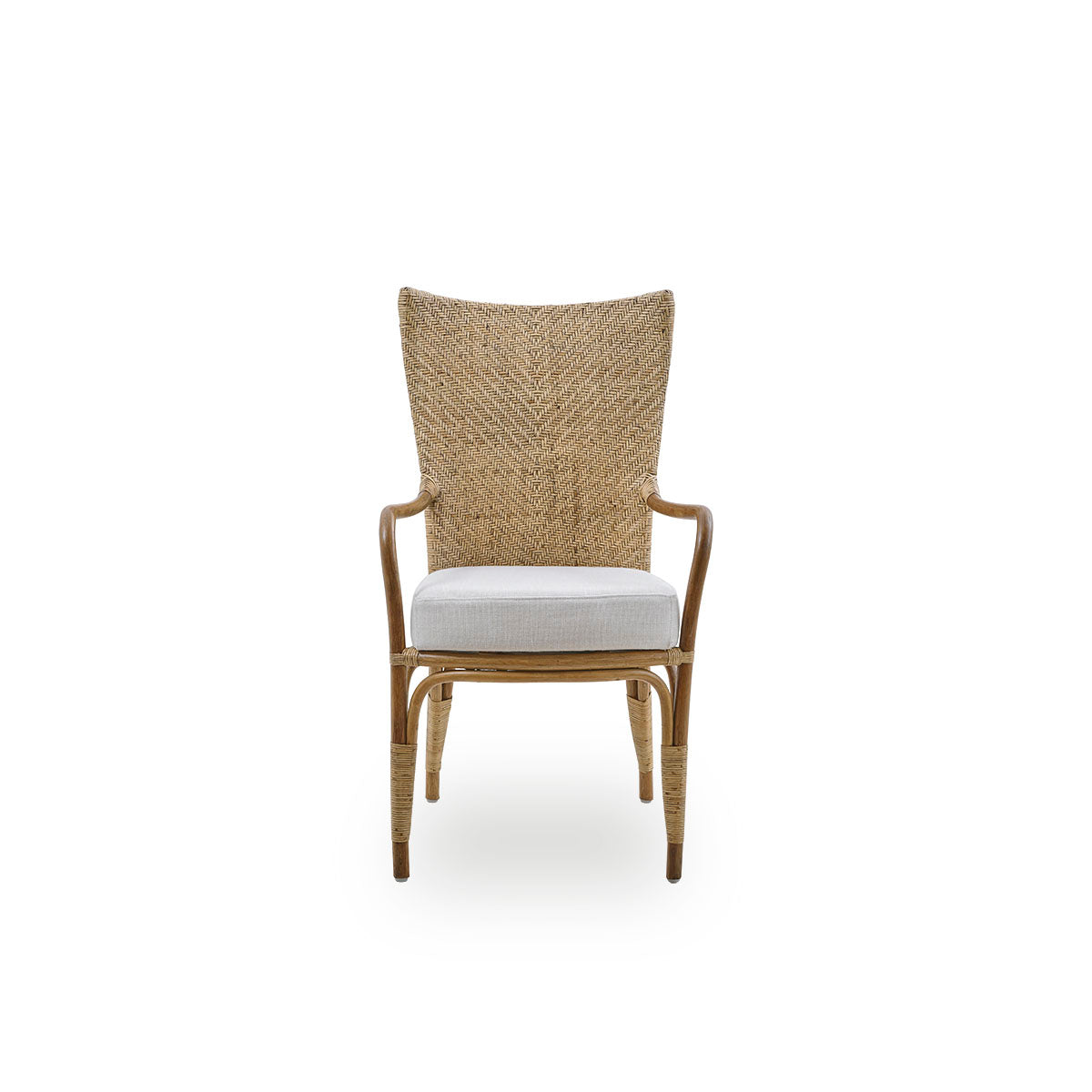 Front view of the Melody dining armchair in antique rattan color with a high fully woven rattan backrest and upholstered seat.