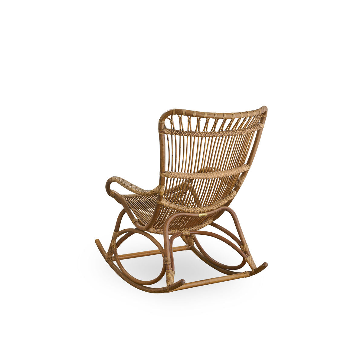 Back side view of the Monet rocking chair with high backrest and armrests presented in antique brown color.
Handcrafted from high-quality Indonesian rattan.