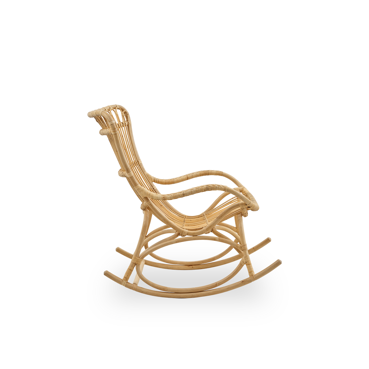 Plain side view of Monet rocking chair with high backrest and armrests presented in natural rattan. Handcrafted from high-quality Indonesian rattan.