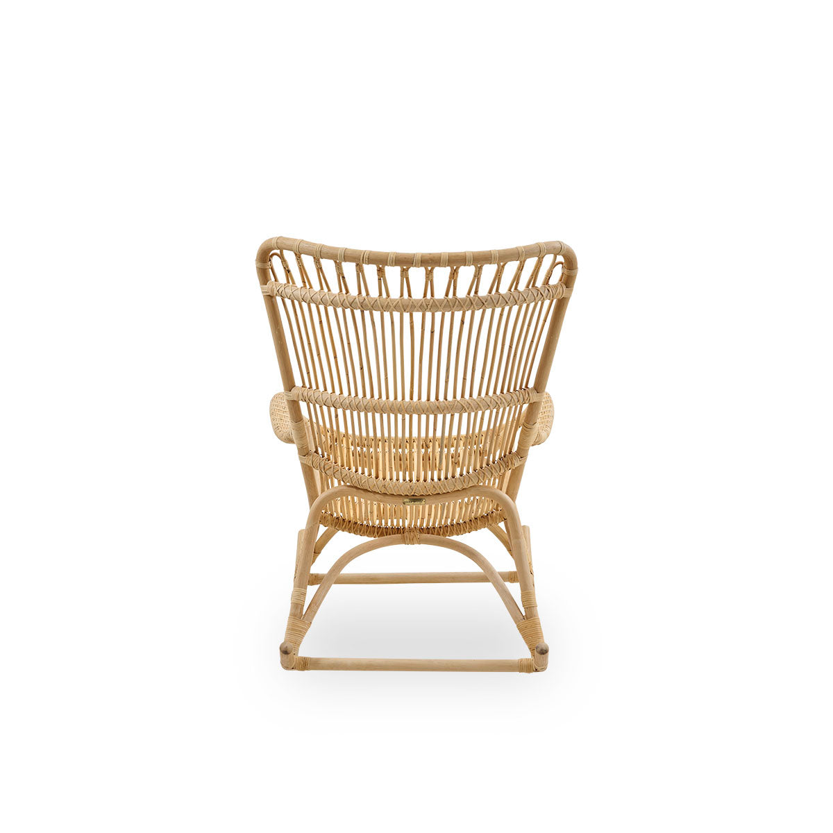Plain back view of Monet rocking chair with high backrest and armrests presented in natural rattan. Handcrafted from high-quality Indonesian rattan.