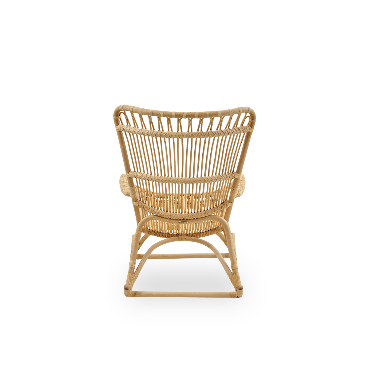 Plain back view of Monet rocking chair with high backrest and armrests presented in natural rattan. Handcrafted from high-quality Indonesian rattan.