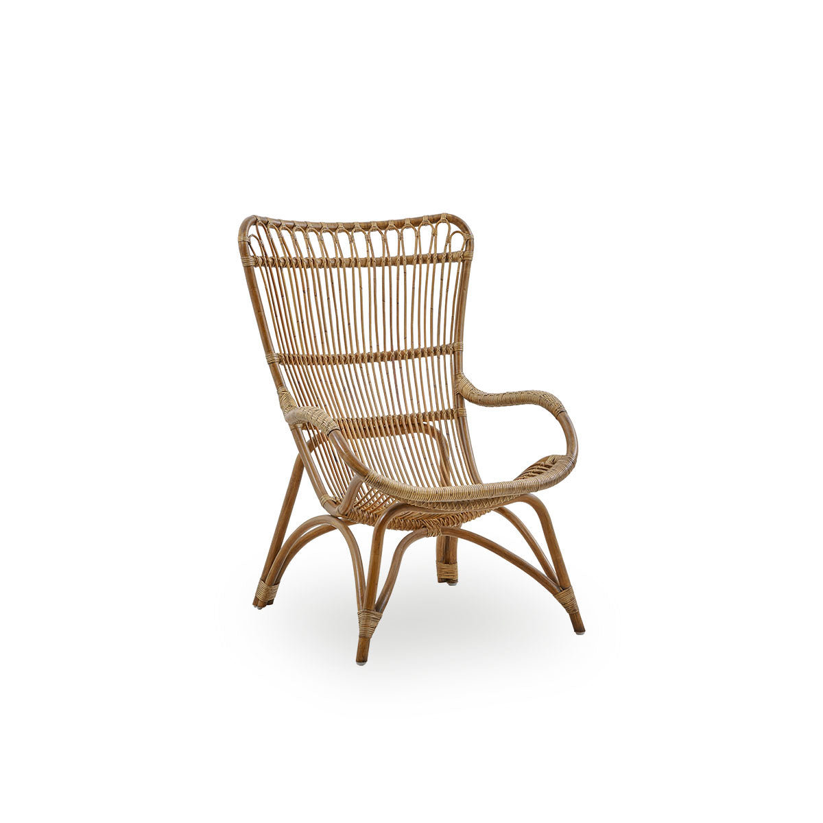Side view of Monet lounge chair with high backrest and armrests presented in Antique brown color. Handcrafted from high-quality Indonesian rattan.