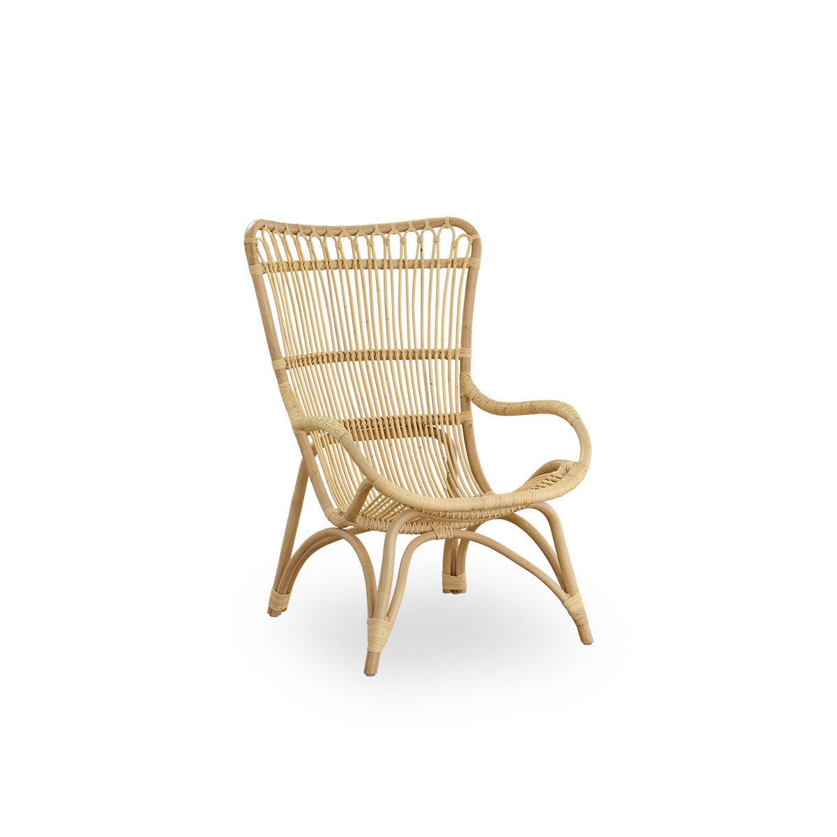 Side view of Monet lounge chair with high backrest and armrests presented in natural rattan. Handcrafted from high-quality Indonesian rattan.