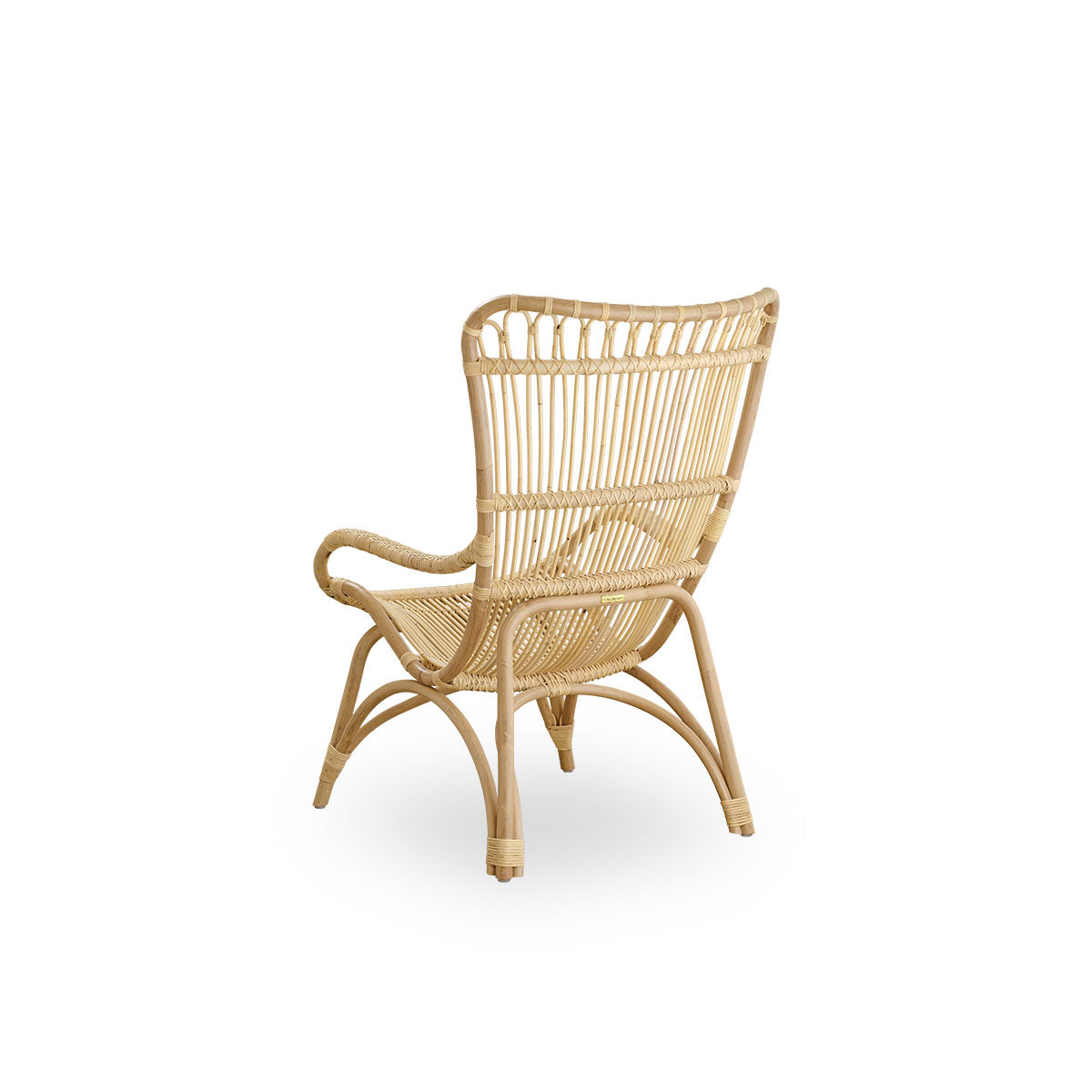 Back side view of the Monet lounge chair with high backrest and armrests presented in natural rattan.
Handcrafted from high-quality Indonesian rattan.