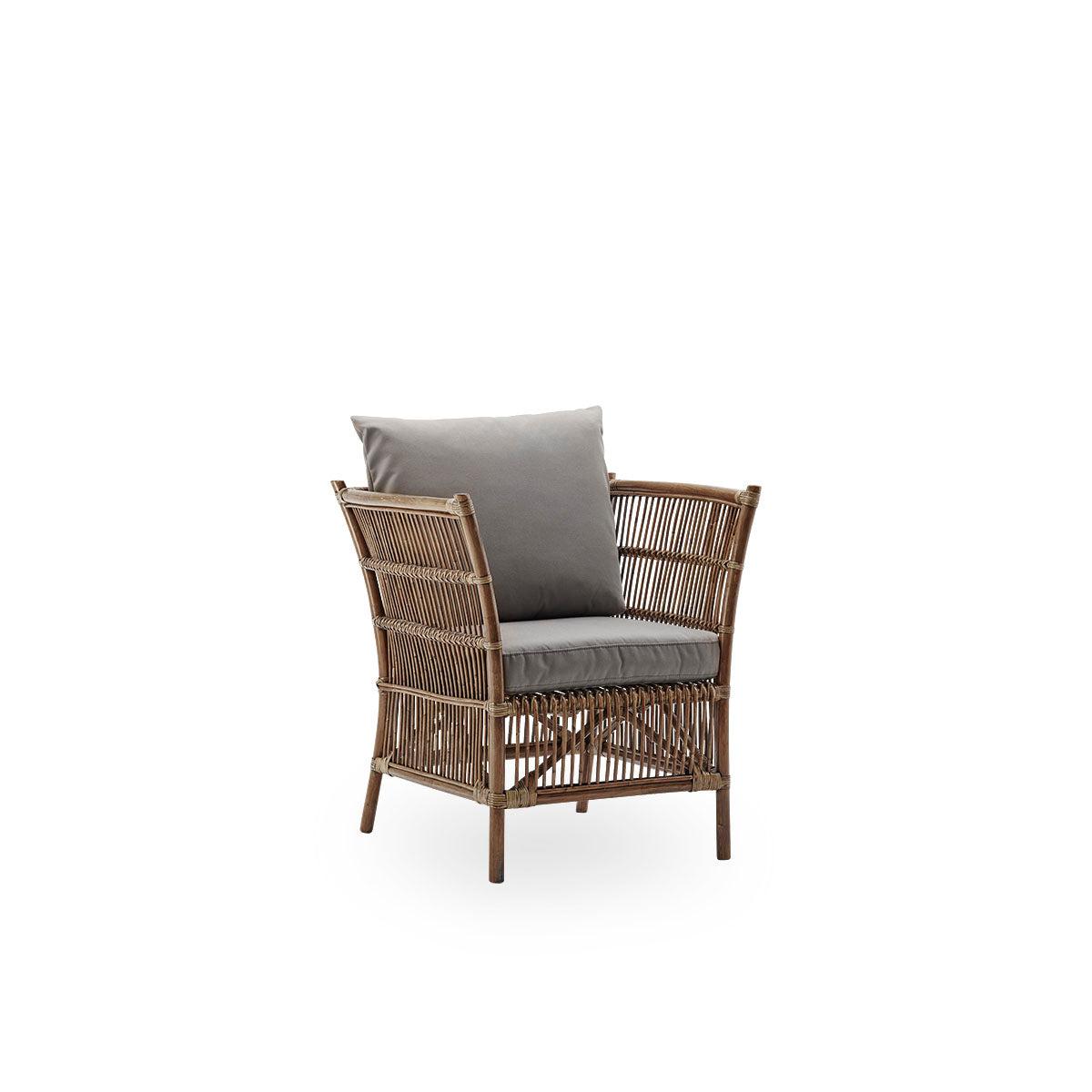 Side view of Donatello wicker lounge chair in Antique brown color. The lounge chair has a boxy design with strict lines handcrafted from high-quality Indonesian rattan.