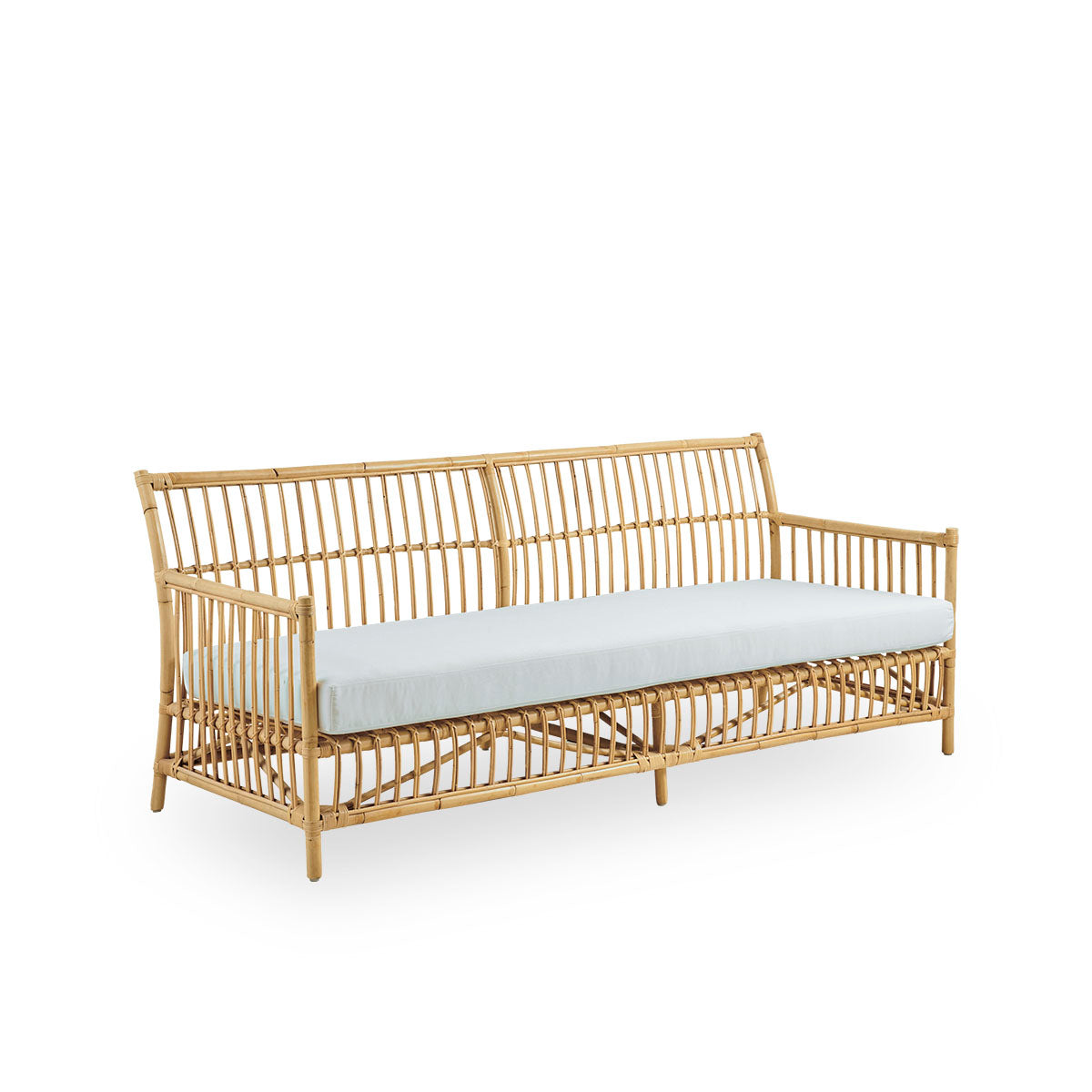 Side view of Caroline 3-seater wicker sofa, simple and elegant Danish design. Handcrafted from Indonesian rattan with detailed woven accents for a cozy, calming presence.