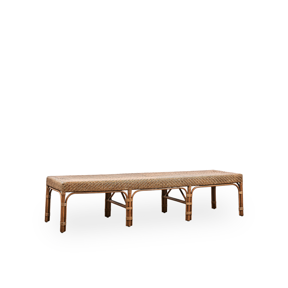 Side view of Luis bench handcrafted from high-quality Indonesian rattan in Antique brown color. Elegant design with finely woven seat. Length 180 cm.
