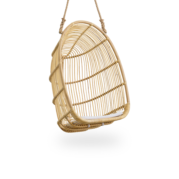 Side view of Renoir hanging chair in Natural color handcrafted in high quality rattan. Soft, embracing shape suspended with strong rope.
