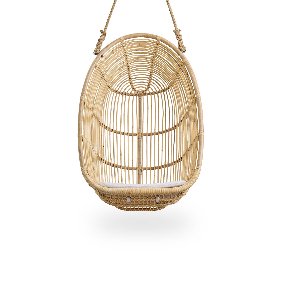 Front view of the Renoir hanging chair in natural color handcrafted in high-quality rattan.
Soft, embracing shape suspended with strong rope.