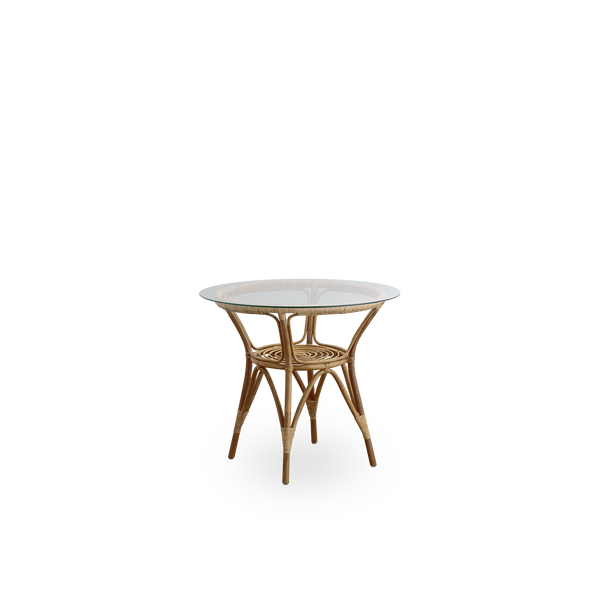 Side view of Tony rattan café table in Antique brown color with 8mm tempered glass top. Rattan frame handcrafted in high-quality Indonesian rattan.