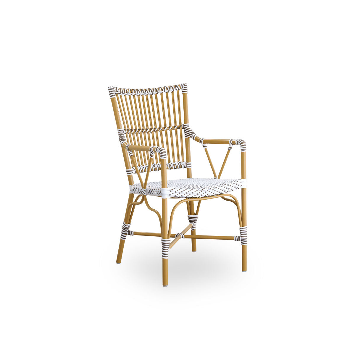 Side view of Monique outdoor dining armchair. Aluminium frame in almond color with seat woven with ArtFibre in white with brown dots. Inspired by 1950s bistro design.