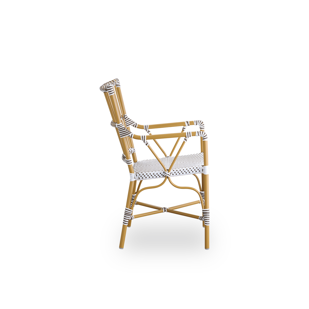 Plain side view of Monique outdoor dining armchair. Aluminium frame in almond color with seat woven with ArtFibre in white with brown dots. Inspired by 1950s bistro design.