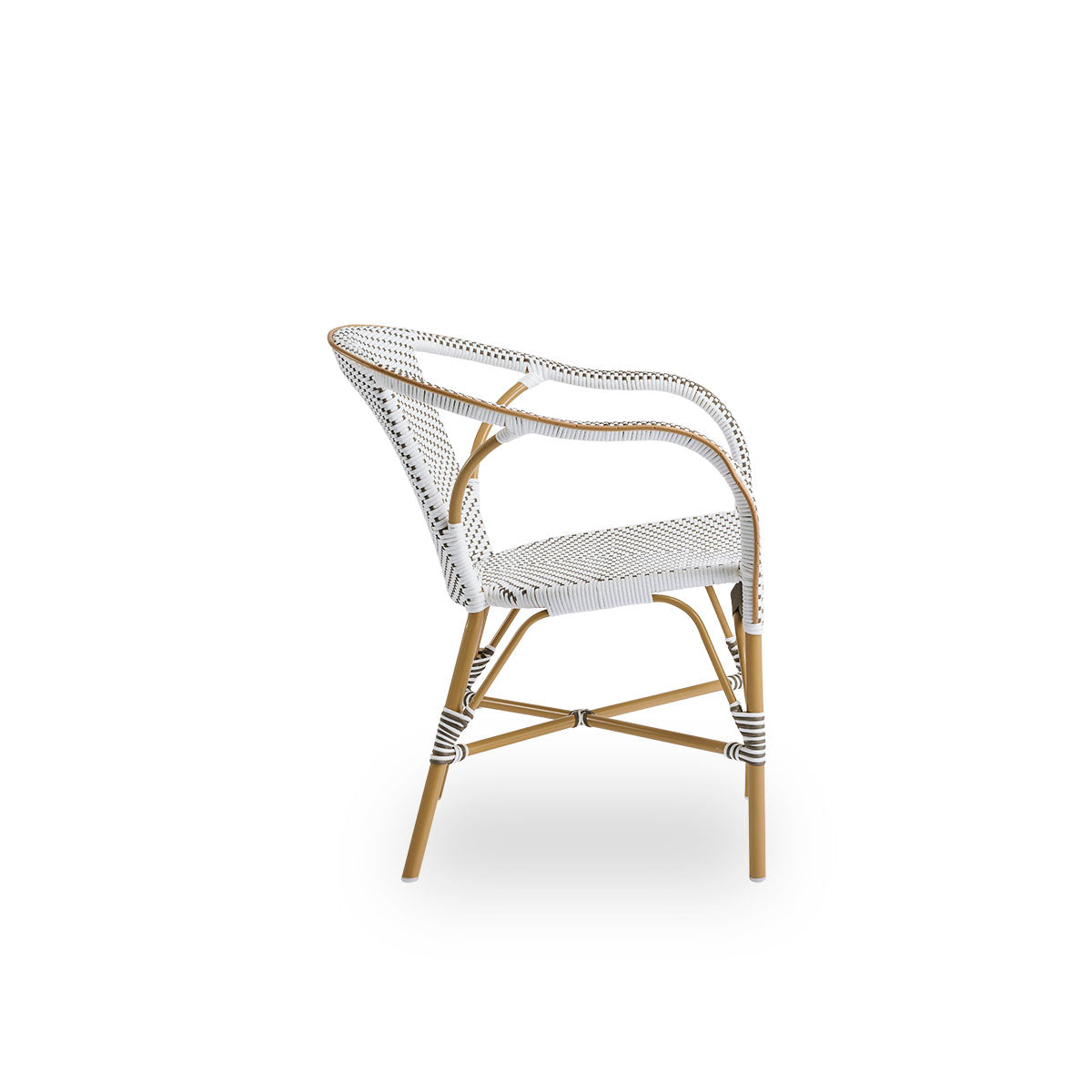 Plain side view of Madeleine outdoor dining armchair. Aluminium frame in almond color with seat and backrest woven with ArtFibre in brown with white dots.