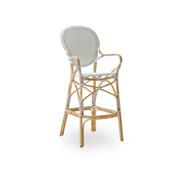 Side view of Isabell barstool with high bagrest, armrests and footrest. Natural rattan frame with ArtFibre seat in white with cappuccino dots. Inspired by 1950s bistro design.