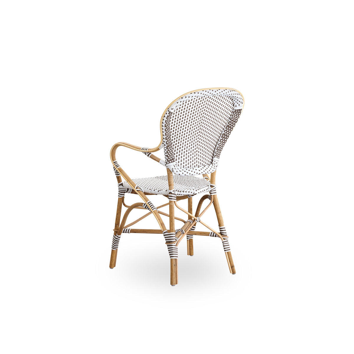 Back side view of the Isabell dining chair with armrests.
Rattan frame with seat and backrest made in white ArtFibre with brown dots. Inspired by 1950s bistro design.