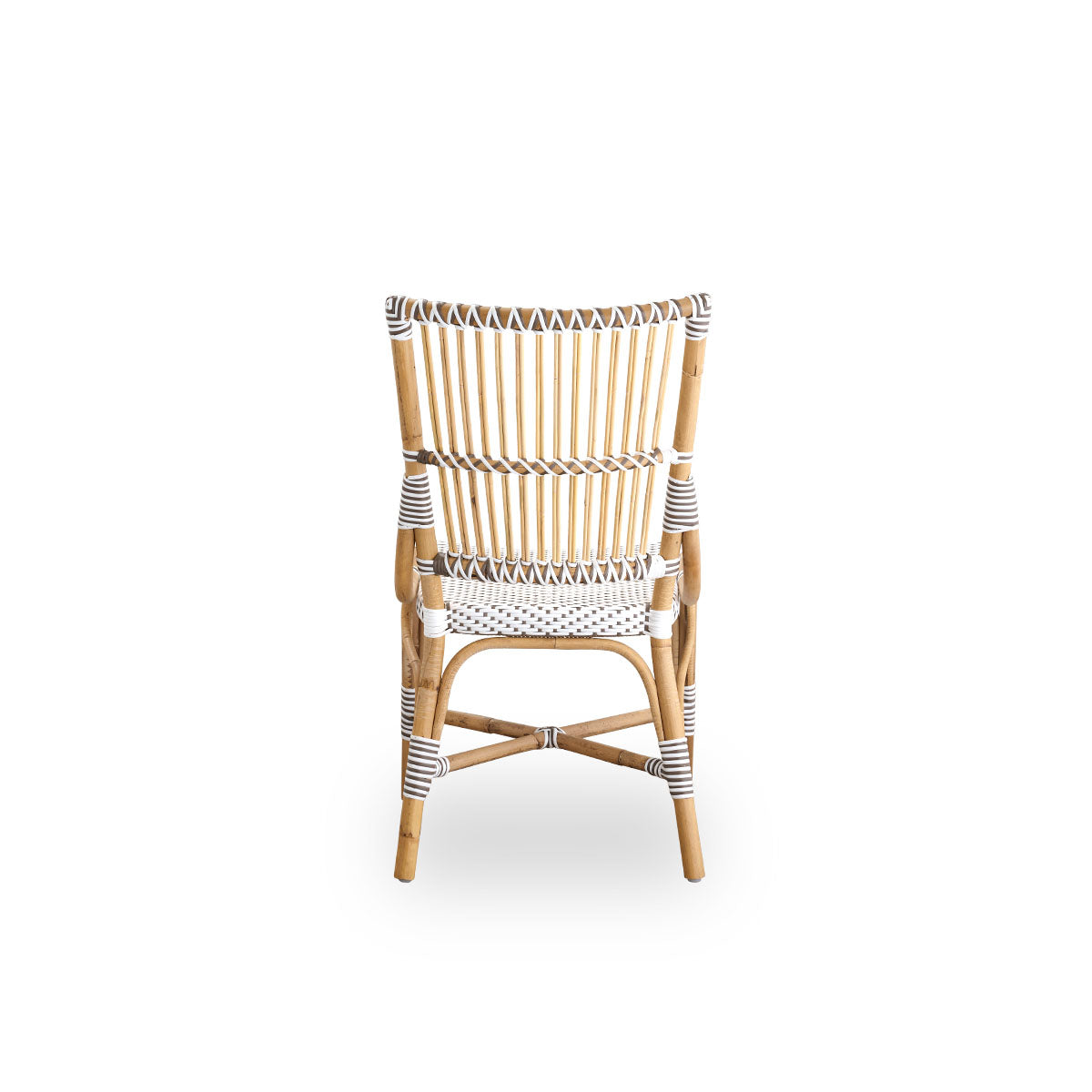 Plain back view of Monique dining chair. Rattan frame with seat woven with ArtFibre in white with brown dots. Inspired by 1950s bistro design.