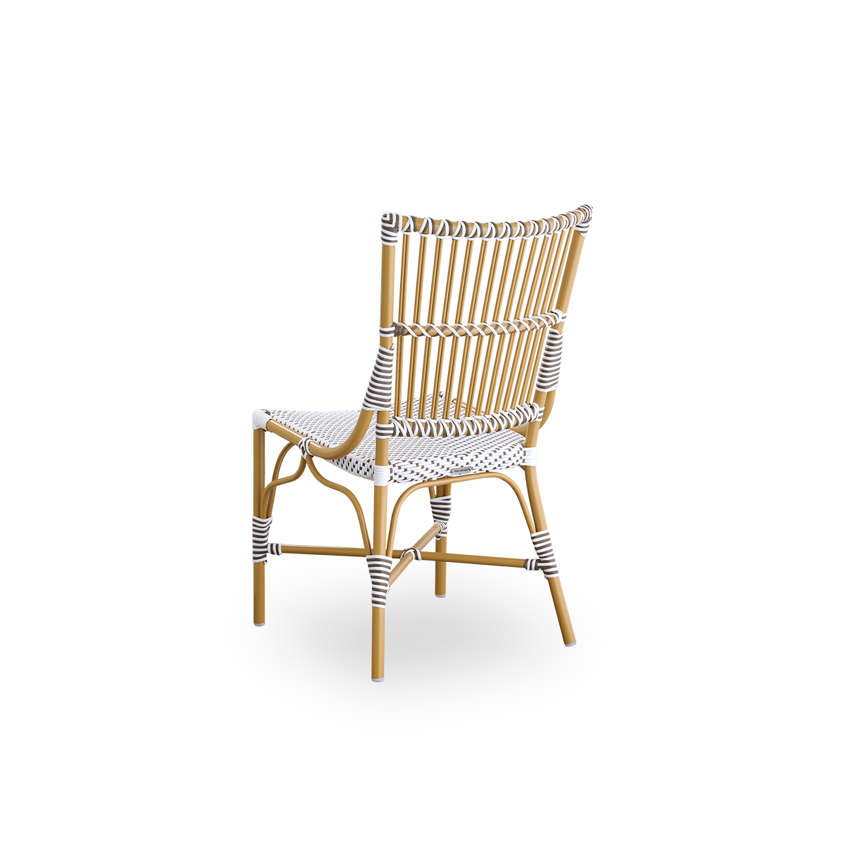Back side view of the Monique dining chair.
Rattan frame with seat woven with ArtFibre in white with brown dots. Inspired by 1950s bistro design.