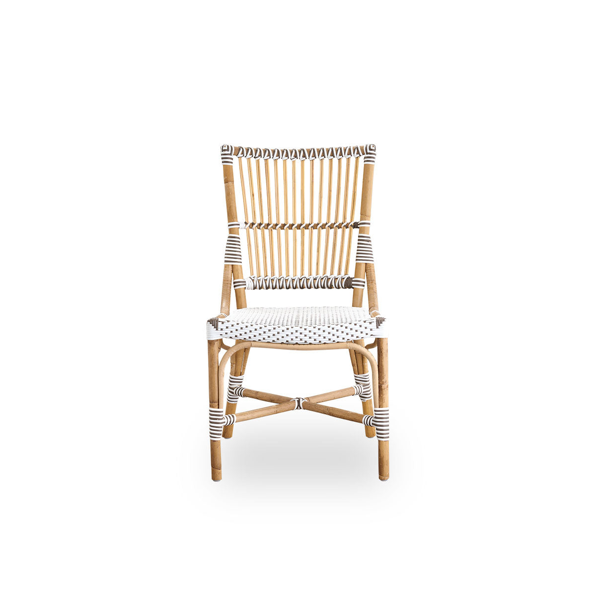 Front view of the Monique dining chair.
Rattan frame with seat woven with ArtFibre in white with brown dots. Inspired by 1950s bistro design.