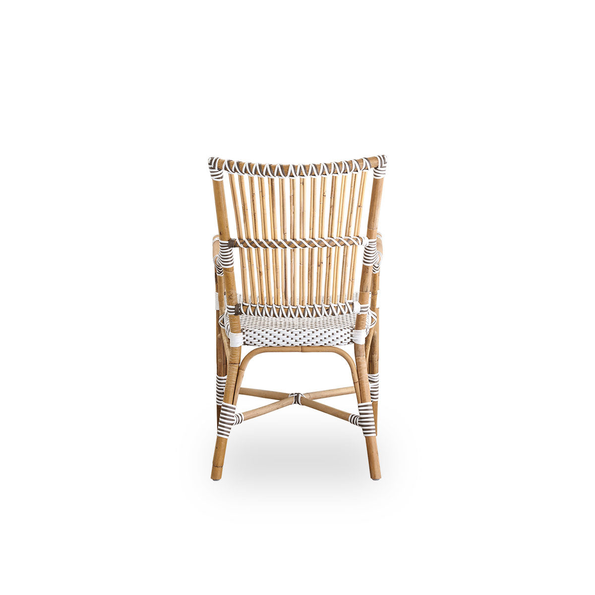 Plain back view of Monique dining armchair. Rattan frame with seat woven with ArtFibre in white with brown dots. Inspired by 1950s bistro design.