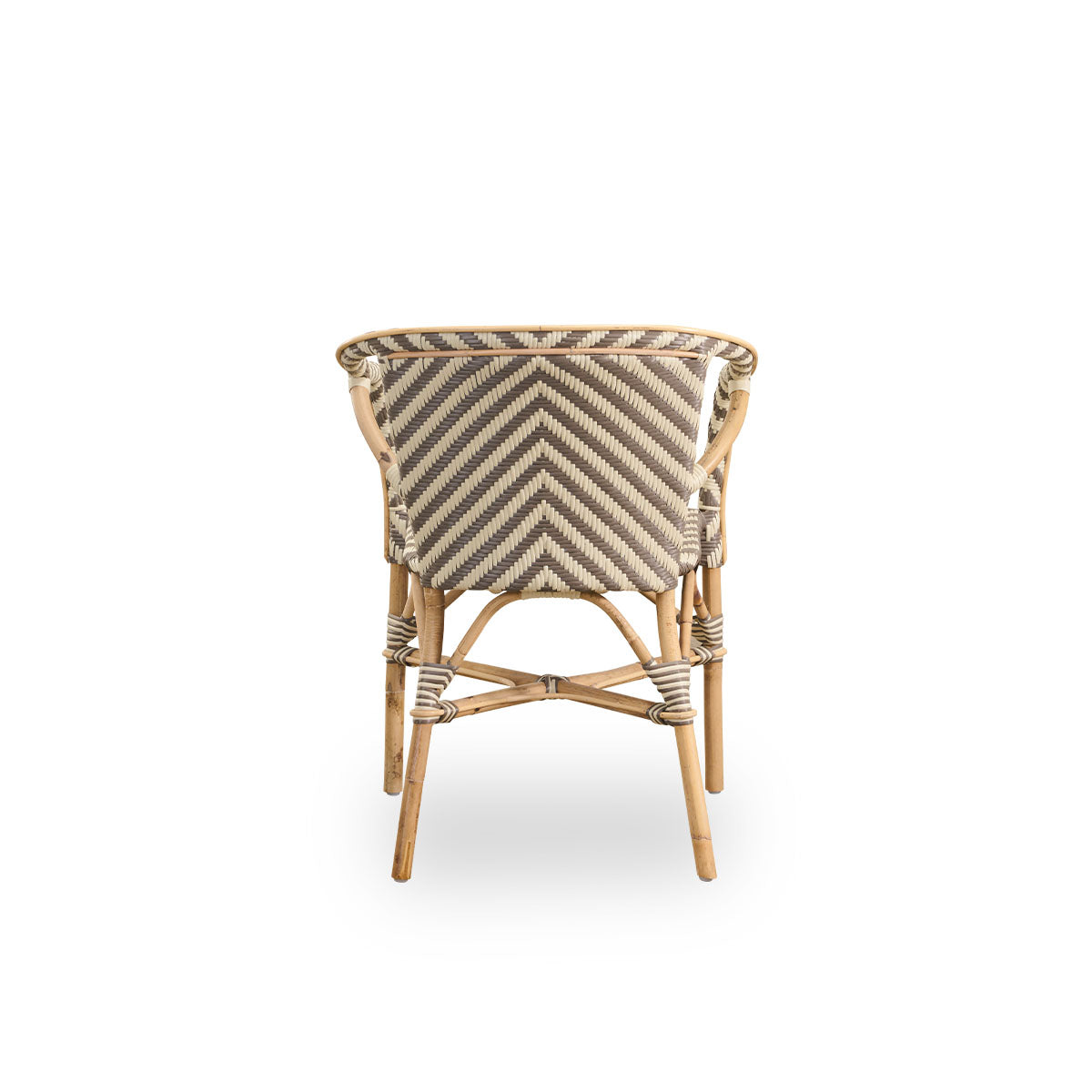 Plain back view of Madeleine dining armchair. Rattan frame with seat and backrest woven with ArtFibre in ivory and brown herringbone pattern. Inspired by 1950s bistro design.