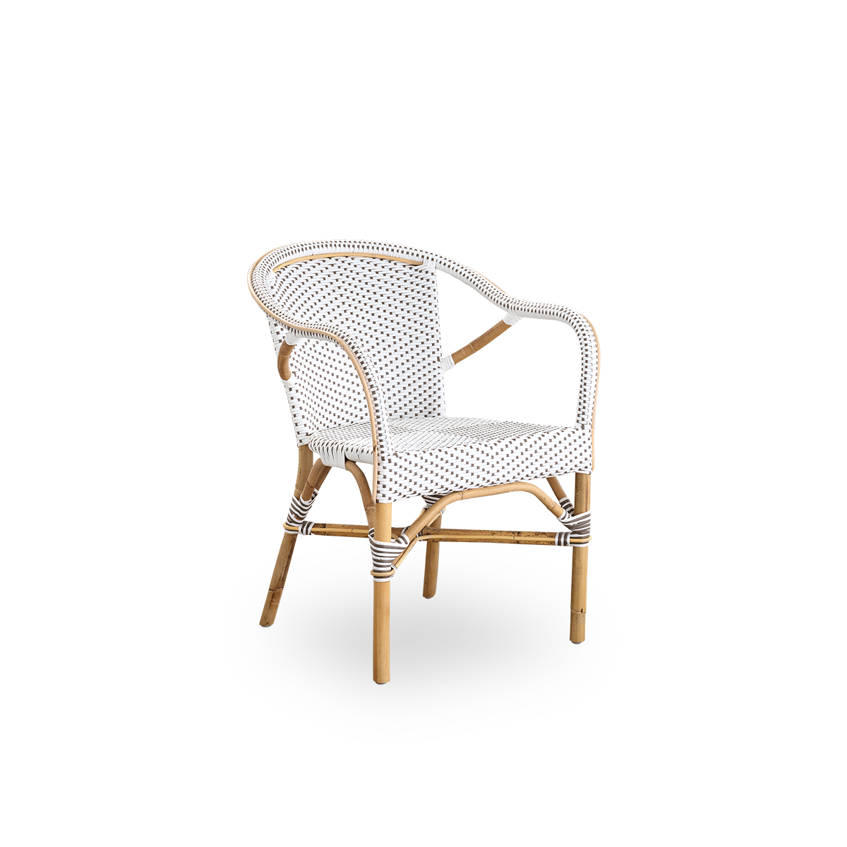 Side view of Madeleine dining armchair. Rattan frame with seat and backrest woven with ArtFibre in white with brown dots. Inspired by 1950s bistro design.